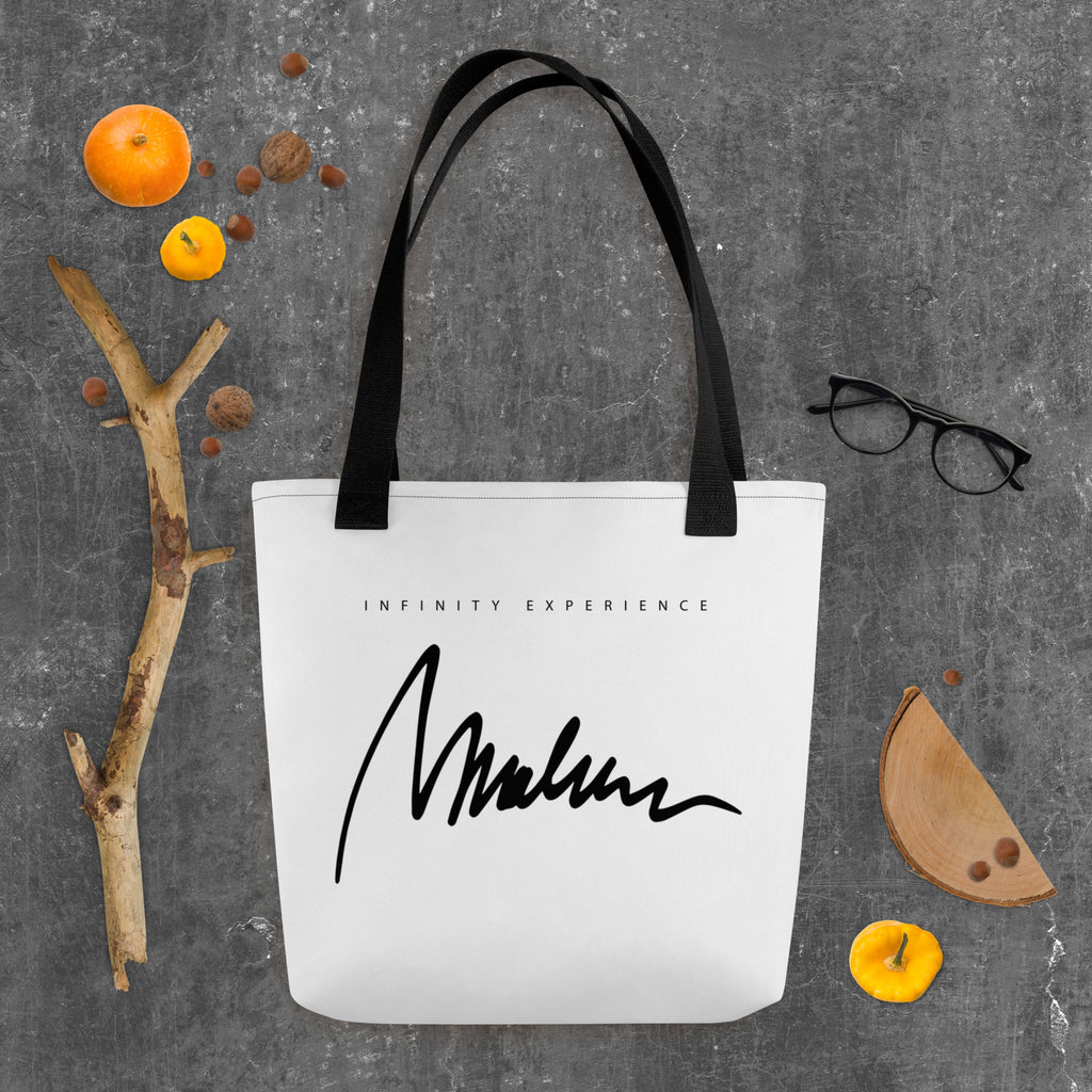 Golden Icon Carry: bolsa blanca con firma negra Marlene en el reverso y asas negras.
