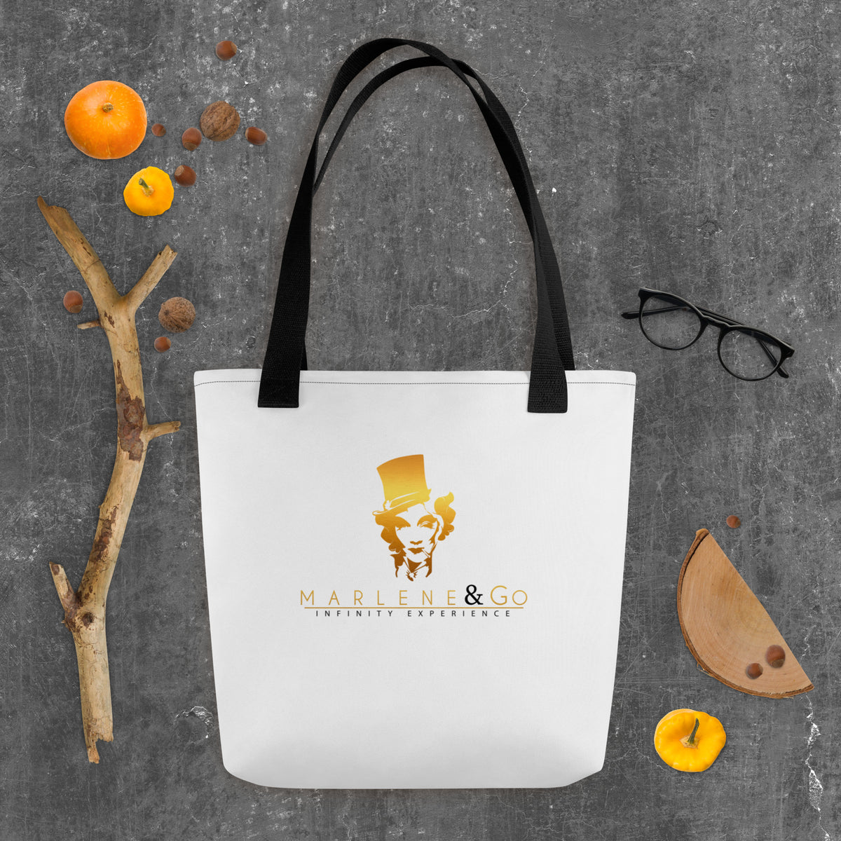 Golden Icon Carry: bolsa blanca con retrato dorado de Marlene y asas negras, vista frontal.