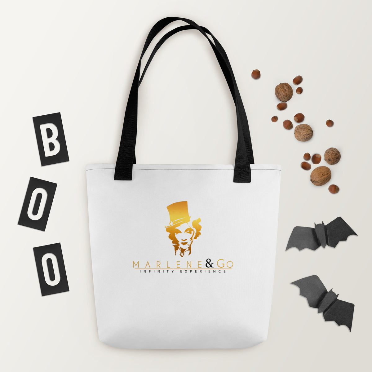 Golden Icon Carry: bolsa blanca con retrato dorado de Marlene y asas negras, vista frontal.