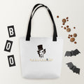 Marlene Crest Carry: bolsa blanca con emblema negro y dorado de Marlene y asas negras, vista frontal.