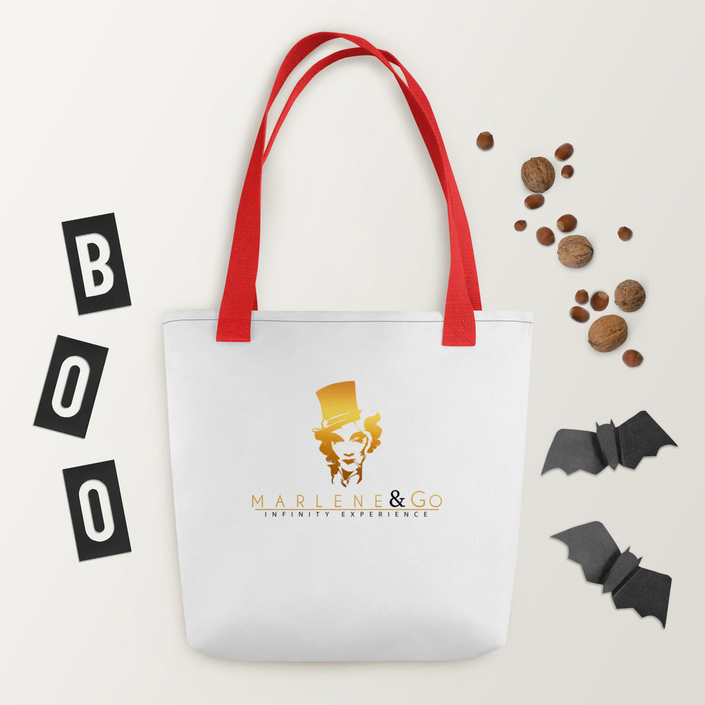 Golden Icon Carry: bolsa blanca con retrato dorado de Marlene y asas rojas, vista frontal.