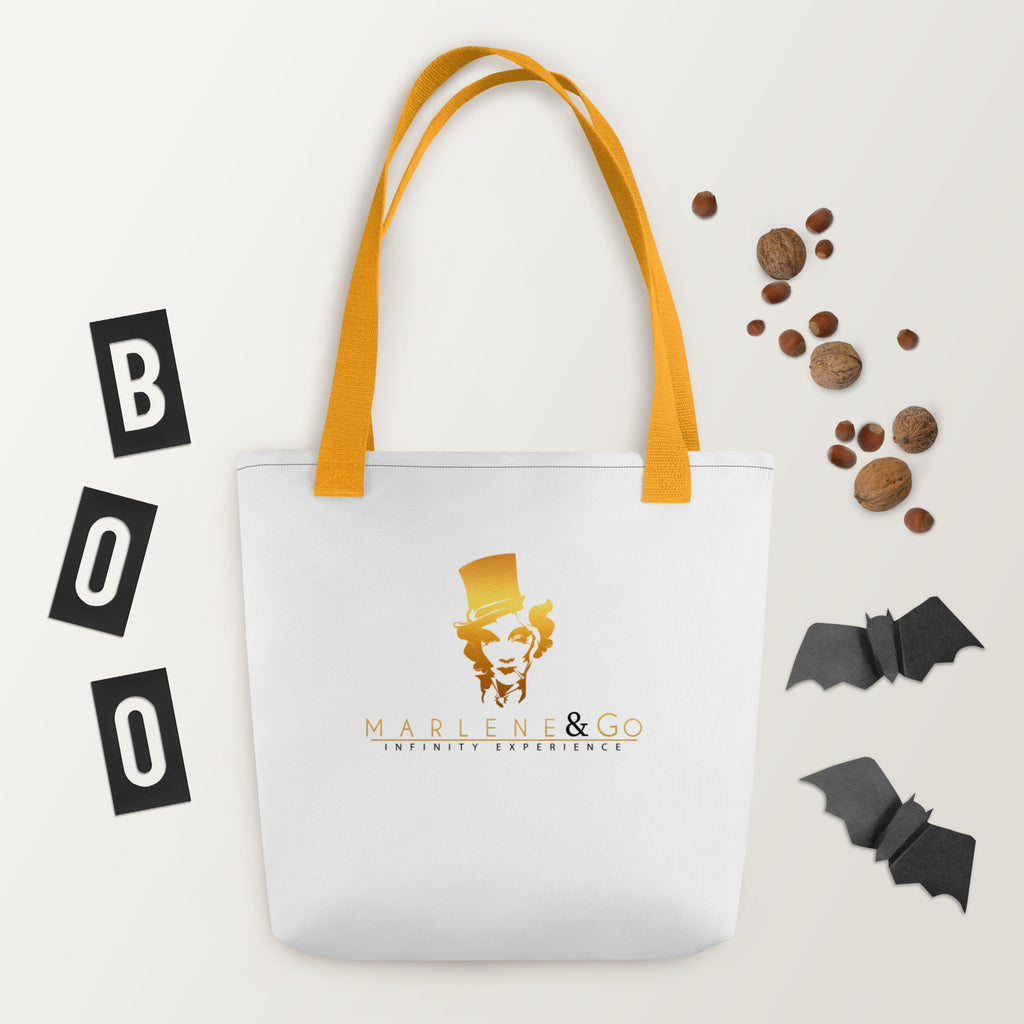 Golden Icon Carry: bolsa blanca con retrato dorado de Marlene y asas amarillas, vista frontal.
